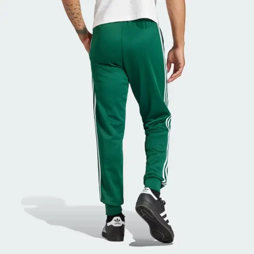 Зеленые брюки adidas - Спортивные брюки Adicolor Classics SST